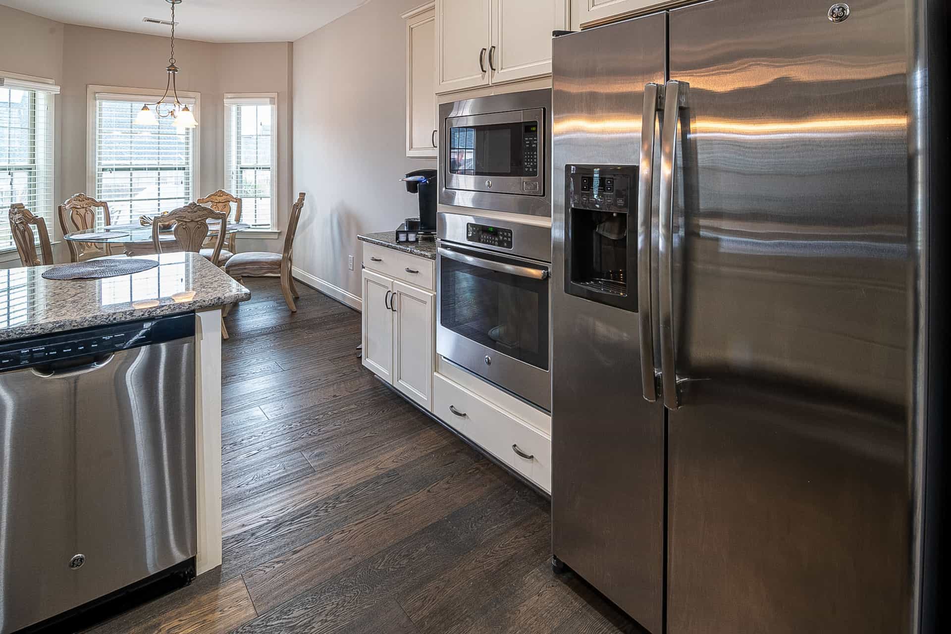 A stainless countertop ice maker on a modern kitchen worktop