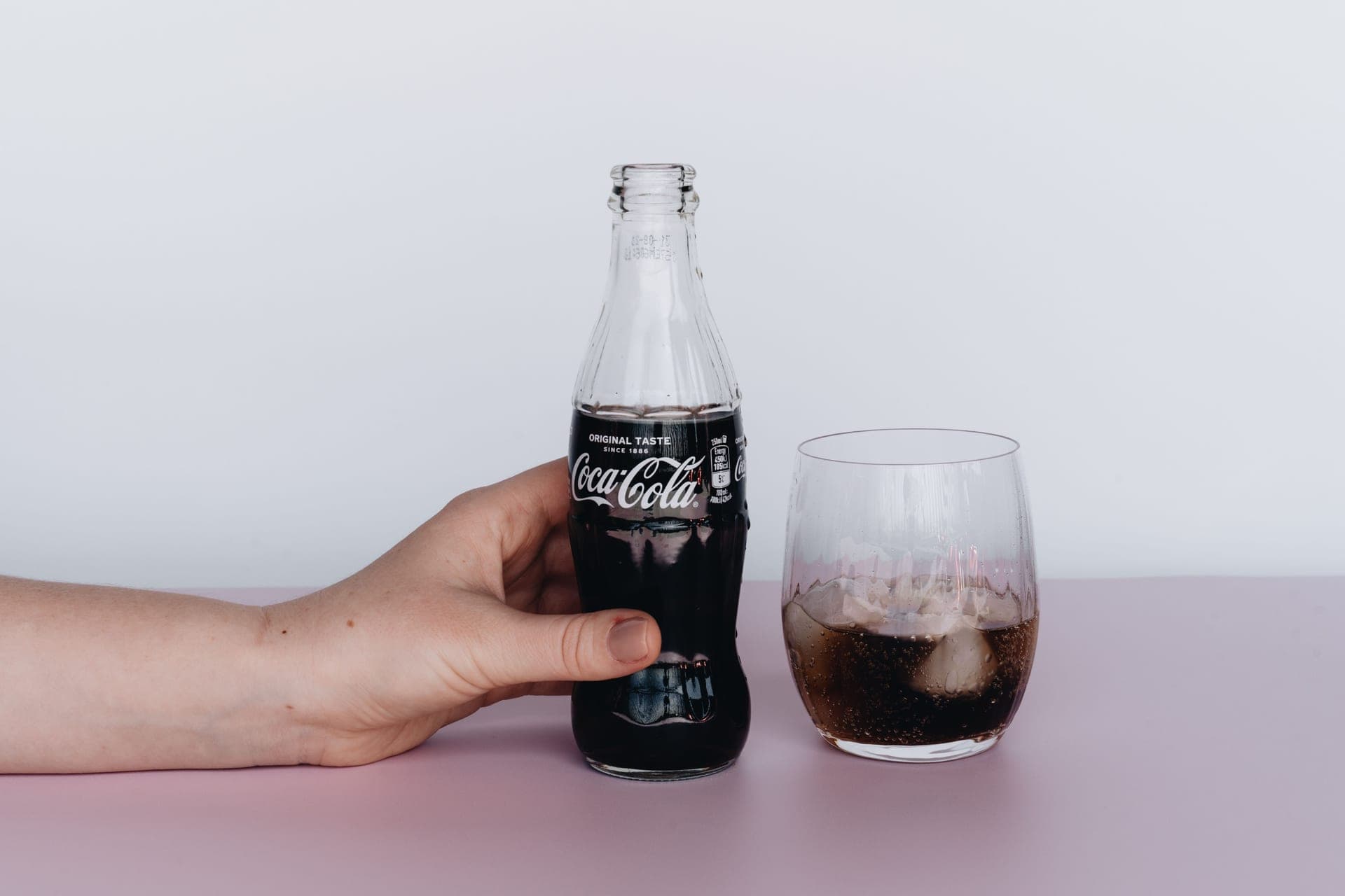 A glass of iced water on a counter