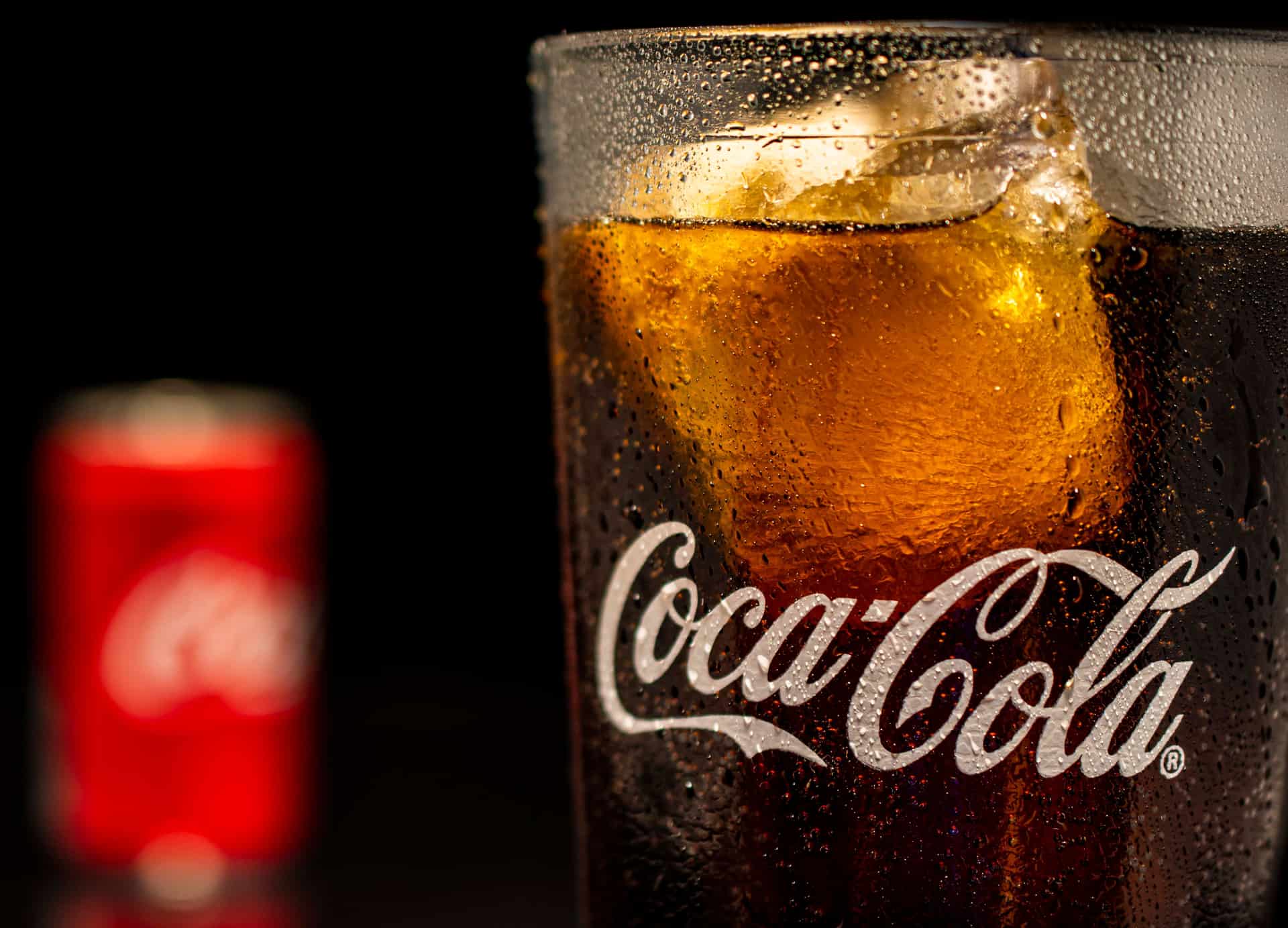 A fountain drink cup being filled with ice