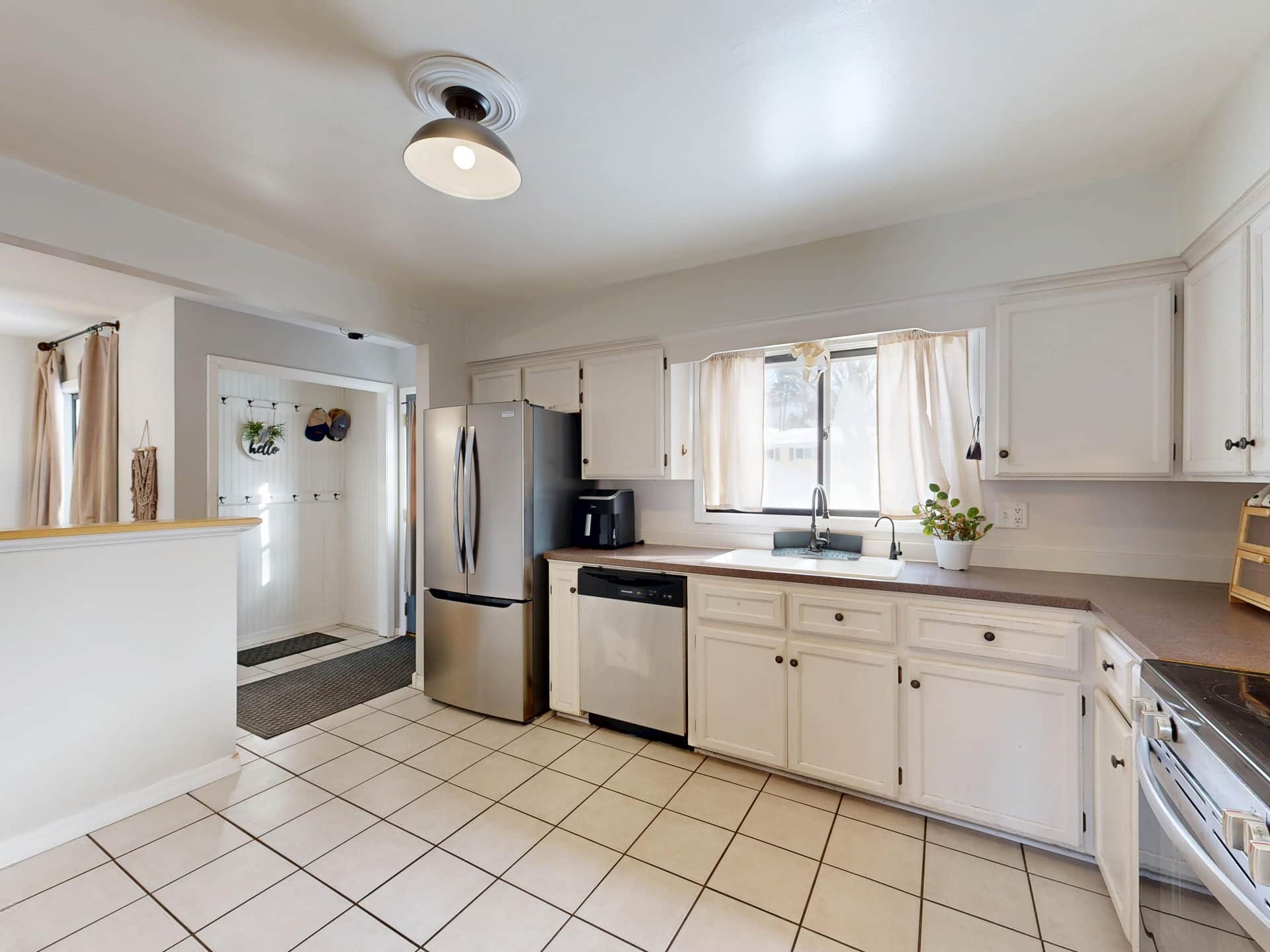 A clean kitchen counter with space for a countertop appliance