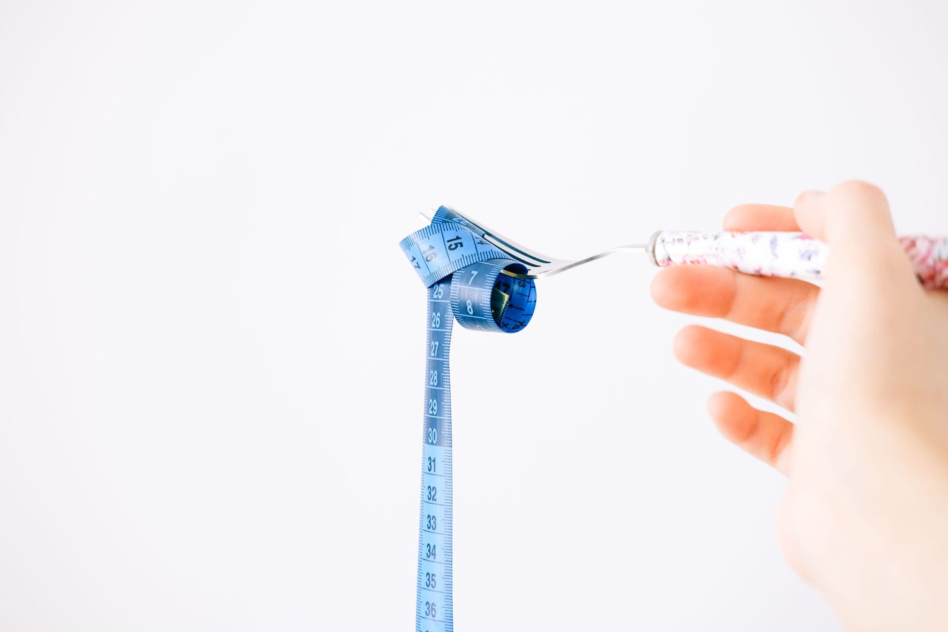 A measuring tape resting on a kitchen counter