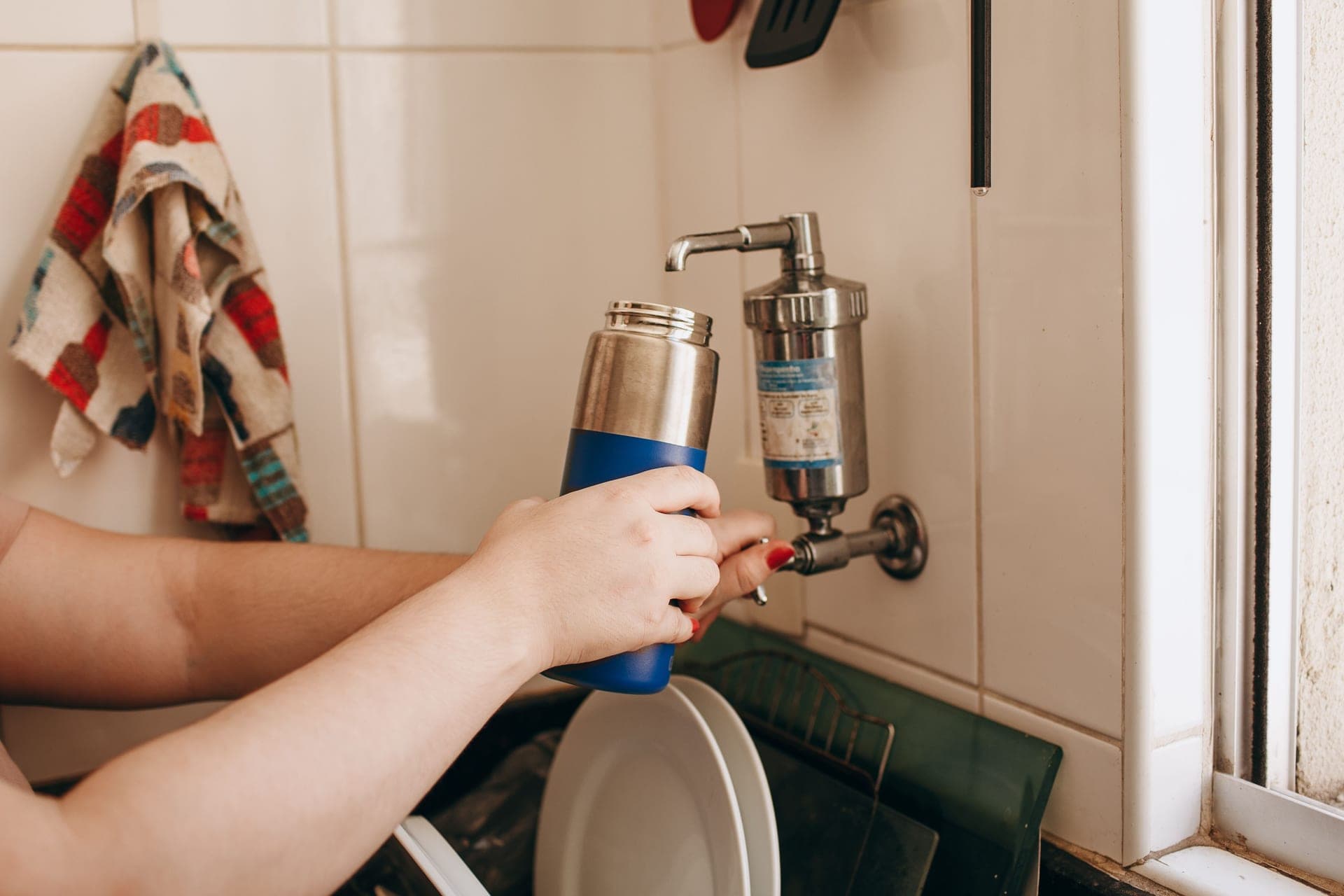 A replacement water filter cartridge on a kitchen counter